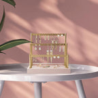 SANY DAYO HOME 3-Tier Earring Holder Organizer Stand, 105 Holes Gold Metal Earring Rack Jewelry Display Tree with Pink Wood Tray for Women and Girls